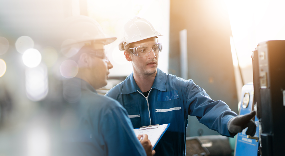 Engineers working on machinery